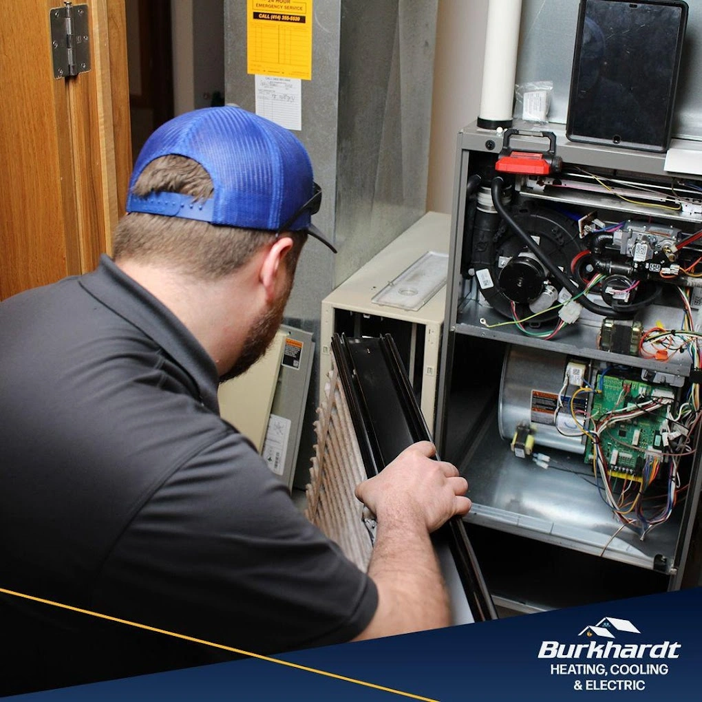 A skilled technician repairing a furnace unit