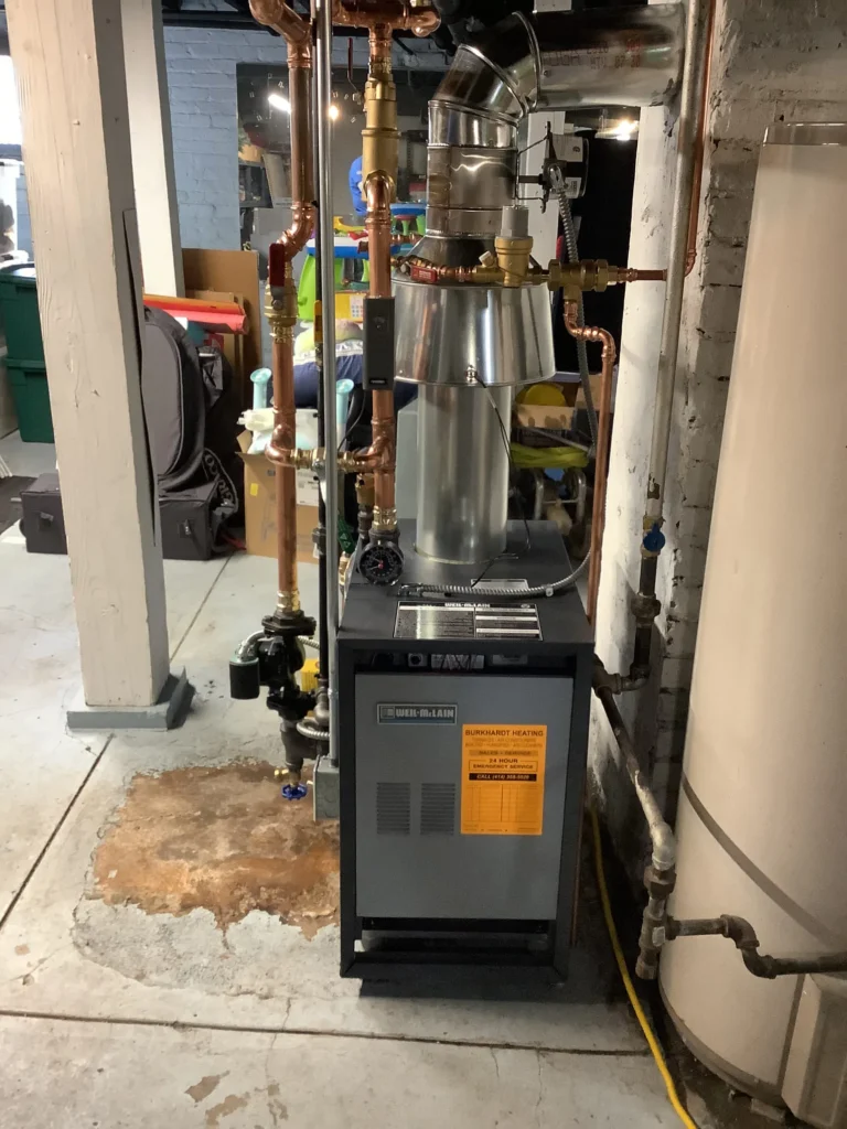 A gas furnace and water heater positioned in a garage