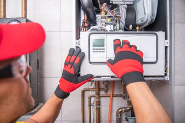 Technician inspecting the furnace systems