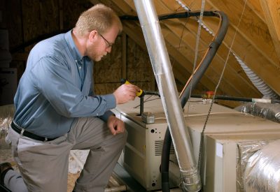 Technician inspecting the furnace systems