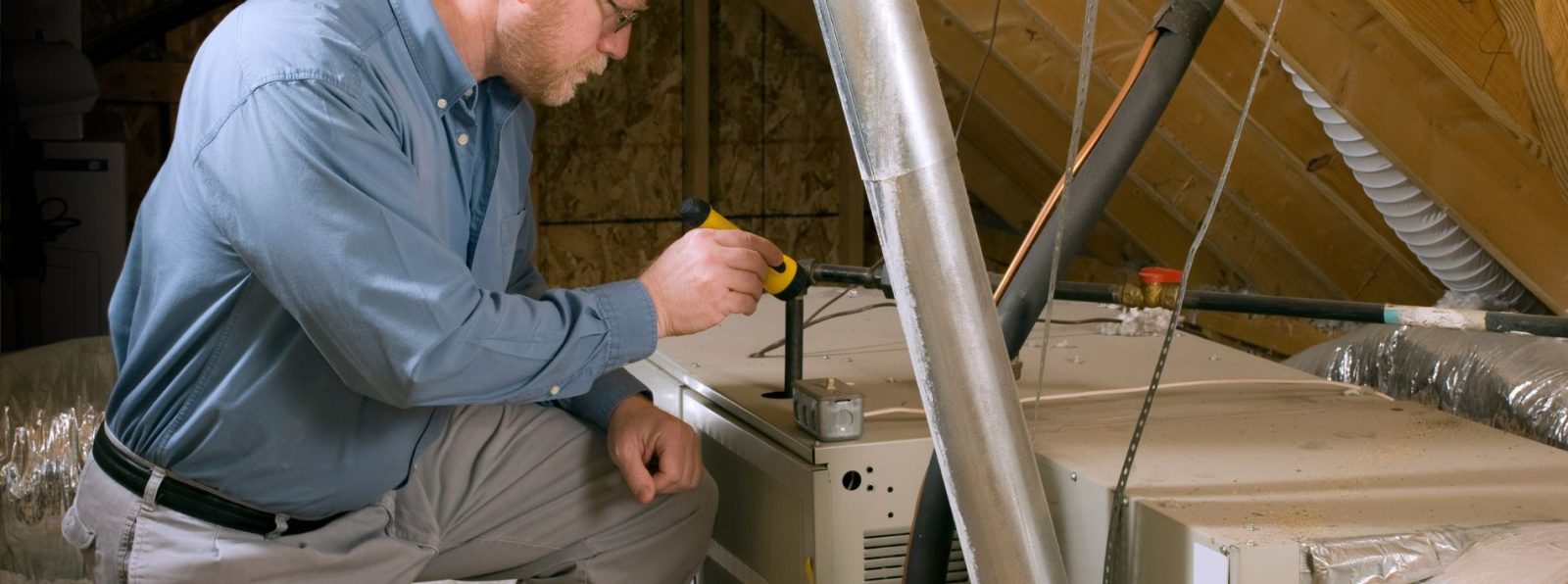 Technician inspecting the furnace systems