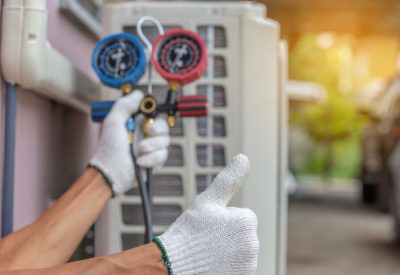 Technician performing Heating & Air Conditioning related services