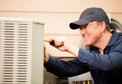 HVAC Technician Performing AC Maintenance in Milwaukee, WI