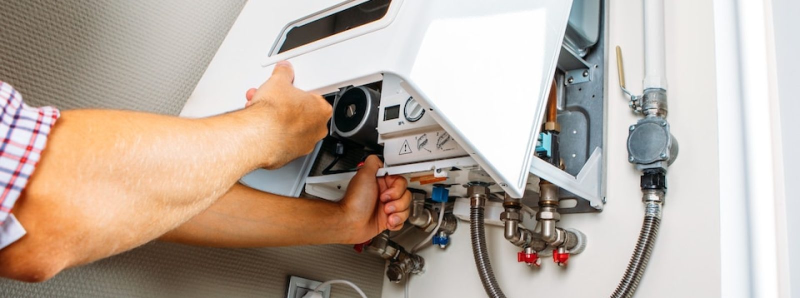 A professional technician repairing a water heater