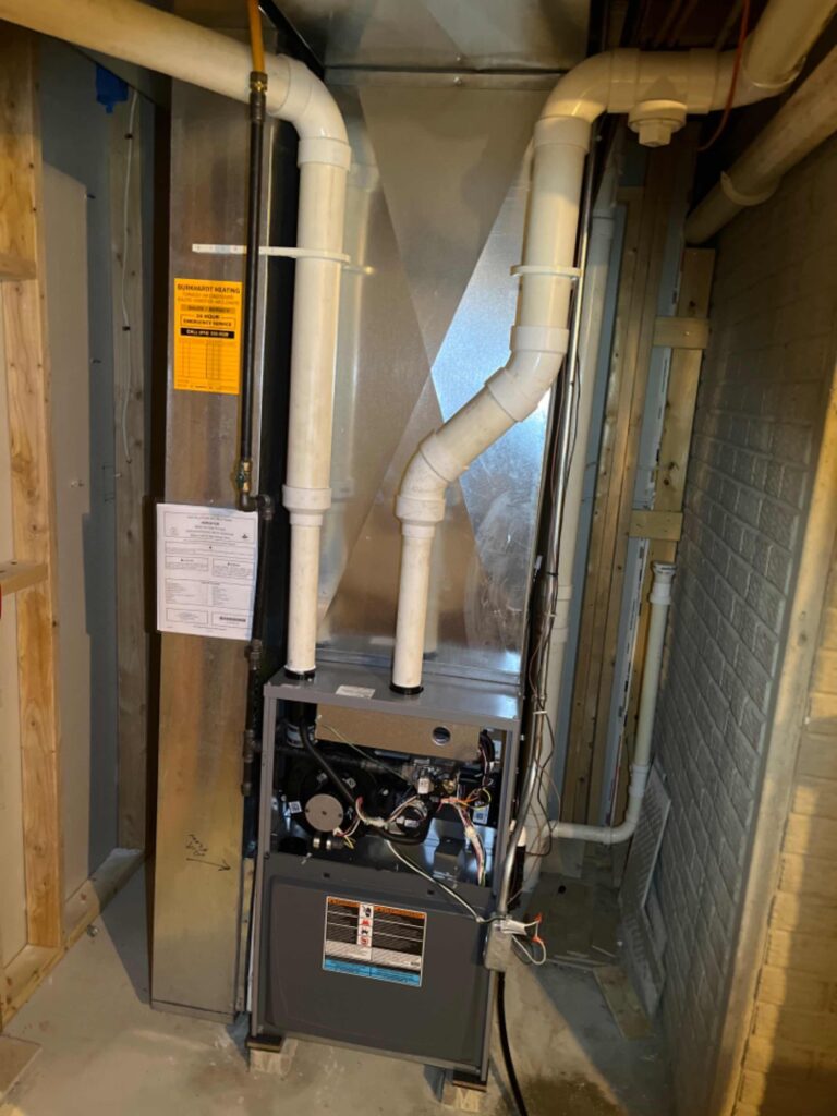 A furnace and air conditioner installed in a residential setting