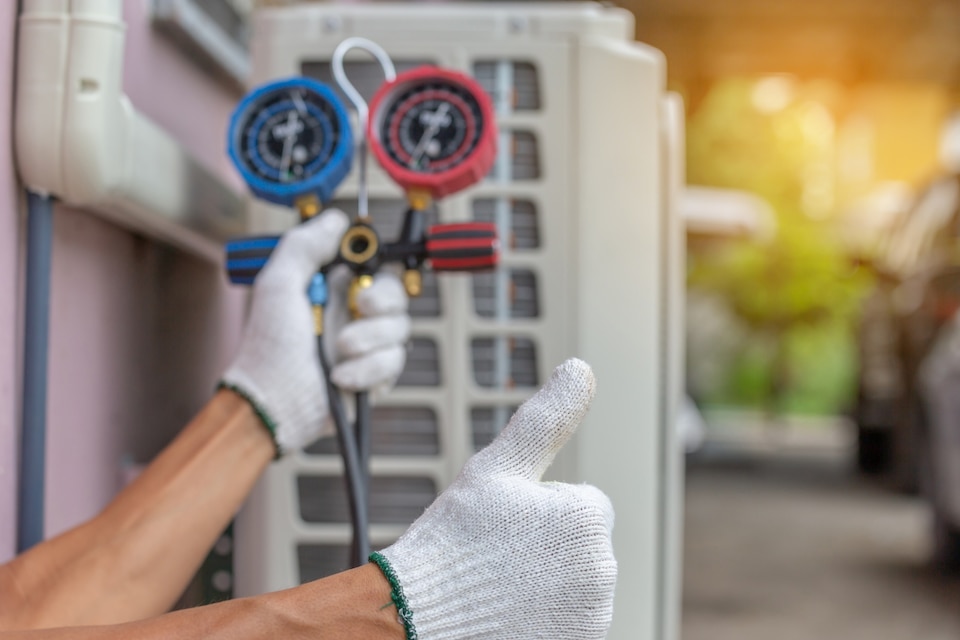 Technician performing Heating & Air Conditioning related services